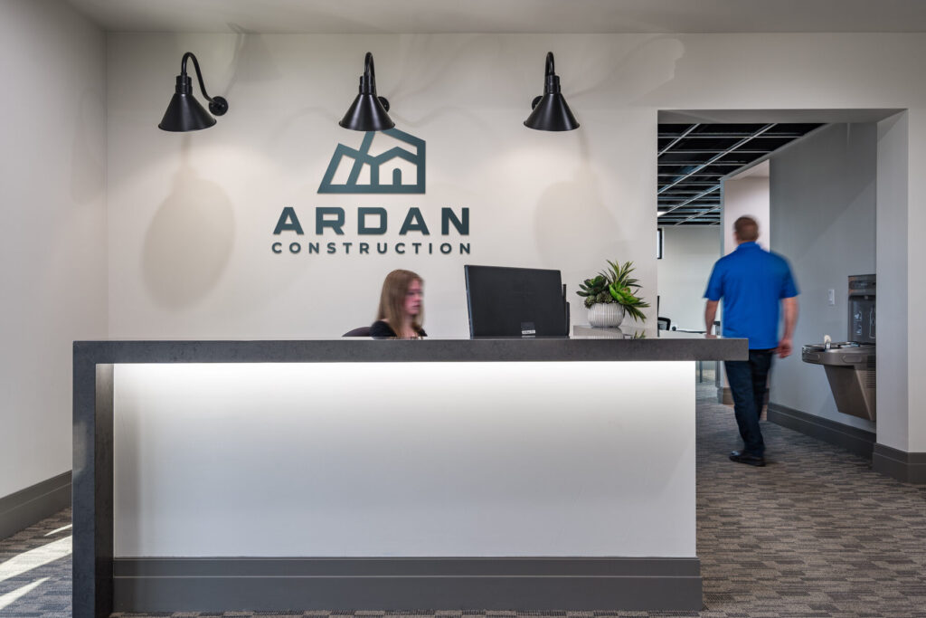ArDan Construction office reception desk wall logo entryway